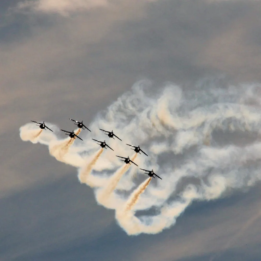 Military aircraft flying in formation